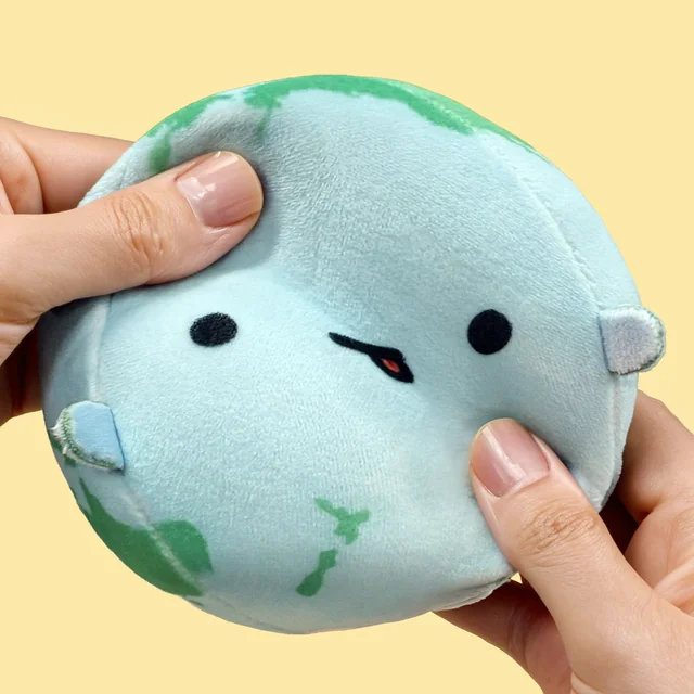 Endearing Earth squeezed between two thumbs